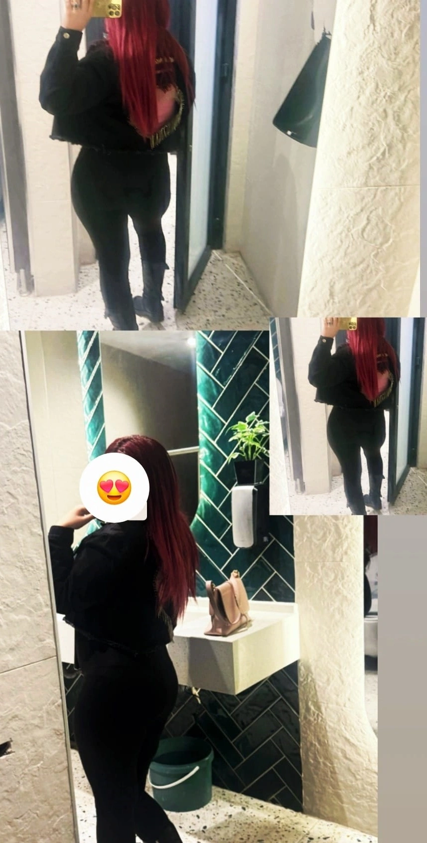 Person with long red hair in a black outfit taking a mirror selfie in a bathroom.