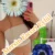 Person in gray underwear takes a mirror selfie; face hidden by a large blue flower sticker; bold orange Turkish text overlays advertise Mersin escort service.
